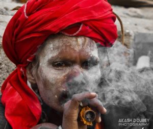 Sadhu smoking a little something something! Photo by Akash Dutt Dubey